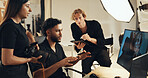 People, backstage or talking for photography or teamwork for production results, planning or review. Studio, producer or computer to check for fashion photographer, magazine catalog or filming ideas