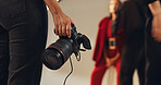 Hands, photographer and people in studio, camera and pictures for fashion magazine and production. Backstage, photoshoot and group with project for media agency, creative or equipment for photography