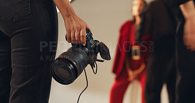 Buy stock photo Hands, photographer and people in studio, camera and pictures for fashion magazine and production. Backstage, photoshoot and group with project for media agency, creative or equipment for photography