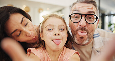 Buy stock photo Selfie, tongue out and family on sofa in home for memory, bonding or social media post together. Portrait, photography and parents with girl child for goofy profile picture in living room at house