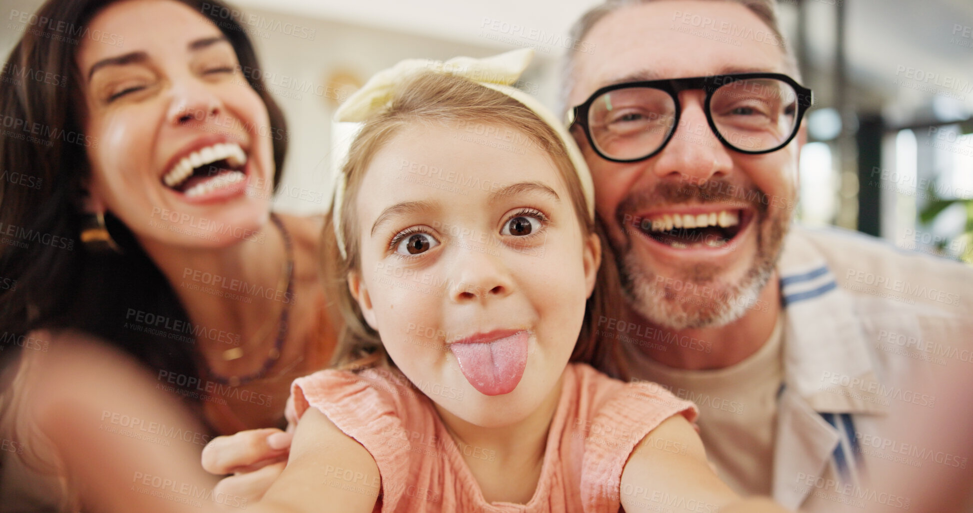 Buy stock photo Selfie, laughing and family on sofa in home for memory, bonding or social media post together. Goofy, photography and parents with girl child for silly profile picture in living room at house.