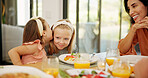 Children, food and girl with gossip whisper at lunch for sibling secret, mystery news or mother listening. Family, people and sister share private story in home for trust and confidential information