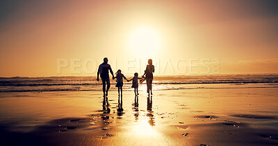 Buy stock photo Sunset, family and holding hands at sea for vacation, walking and bonding together outdoor. Back, mother and father with children at beach with mockup space, travel or summer adventure with parents