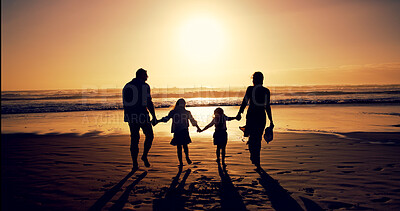Buy stock photo Sunset, family and holding hands with back at beach for holiday, walking and bonding outdoor. Silhouette, mother and father with kids at ocean with mockup space, travel and summer trip with parents
