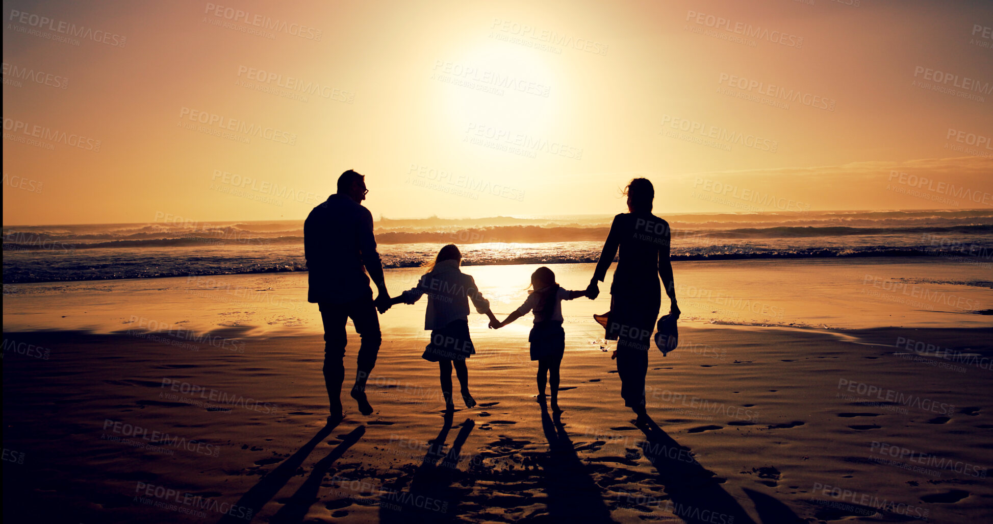 Buy stock photo Sunset, family and holding hands with back at beach for holiday, walking and bonding outdoor. Silhouette, mother and father with kids at ocean with mockup space, travel and summer trip with parents