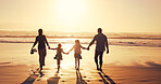 Sunset, family and holding hands at beach for holiday, vacation and bonding together outdoor. Back, mother and father with children at ocean with mockup space, travel or summer adventure with parents