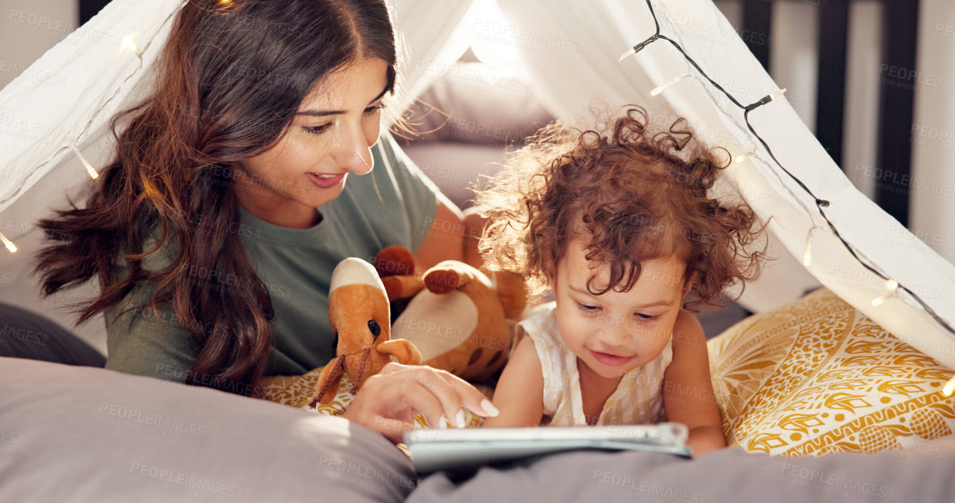Buy stock photo Tent, mom and tablet with girl in home for bonding together, games app and connection with trust. Tech, woman and fun activity with toddler in blanket fort for happy relationship, love or care