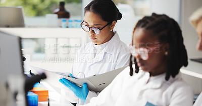 Buy stock photo Medical research, scientists and women with document, lab and info for treatment of disease or cure. Healthcare, reading and notes for project in clinic, pharmaceutical and coworking with people