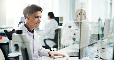 Buy stock photo Man, scientist and typing on computer in lab of medical research, experiment and information. Person, microscope or online of healthcare report, biotech and investigation feedback of vaccine solution