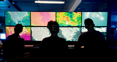 Buy stock photo Weather, screen or monitor with people for forecast, satellite maps or teamwork to track storm. Control room, back or scientists with meteorology for broadcast news, report or silhouette at night