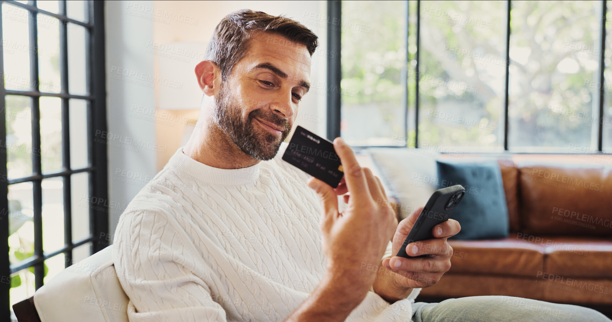 Buy stock photo Home, man and smile with phone for credit card, password and banking app for subscription. House, male person and happy with mobile for debit details, online shopping and payment for website on sofa