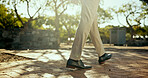 Business, man and walking with feet outdoor for morning commute, journey to work and corporate travel. Professional, person and shoes at park for career opportunity, movement and departure in nature