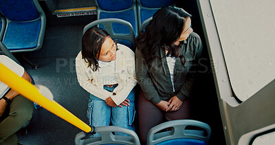 Buy stock photo Window, above and mother with daughter in bus for commute, support and travel together. Public transportation, conversation and shuttle service with woman and girl for metro, chat and family trip