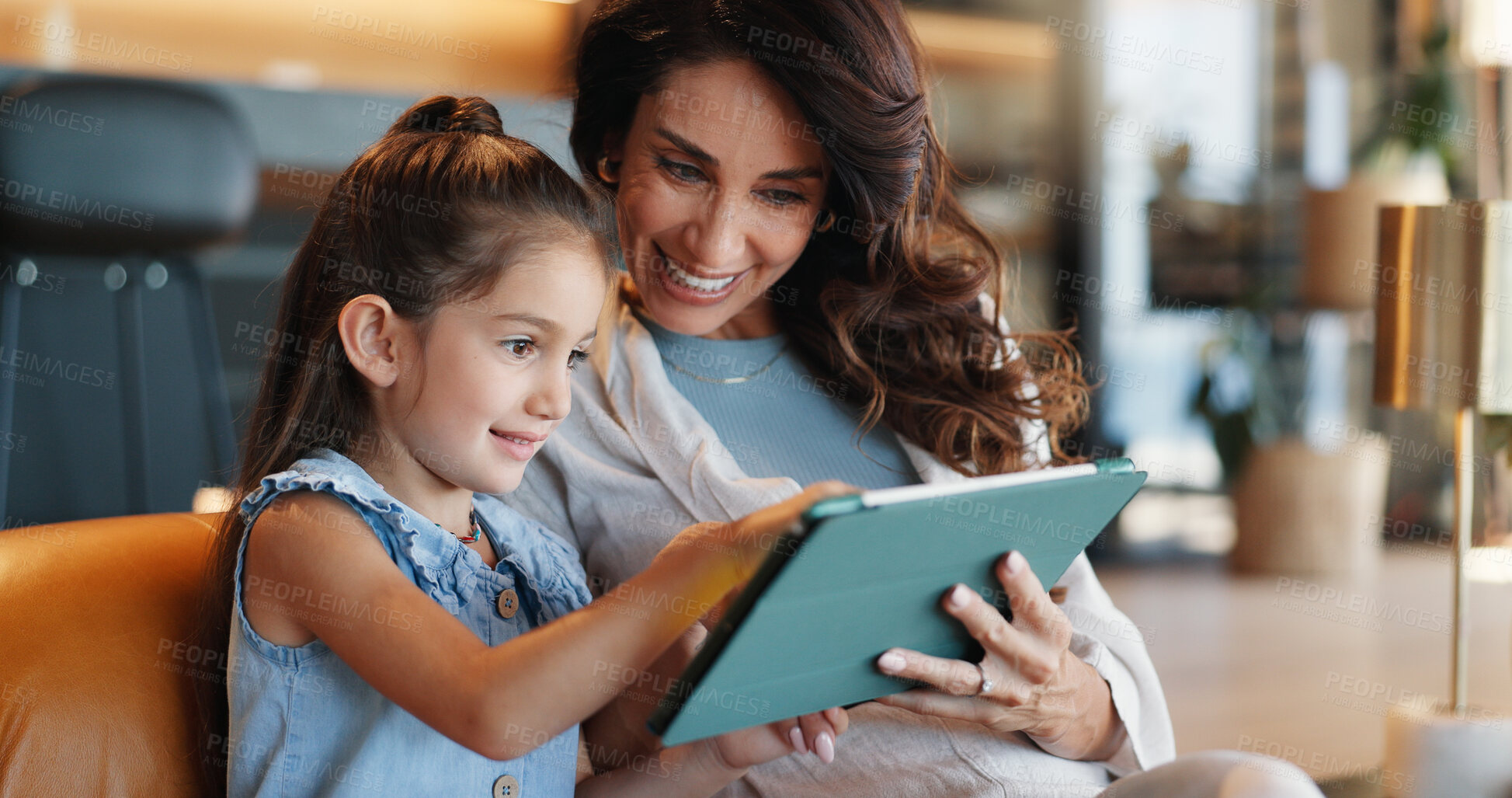 Buy stock photo Tablet, elearning and mom with kid on sofa for playing educational games with online app. Happy, connection and mother teaching girl with digital technology for bonding, development or growth in home