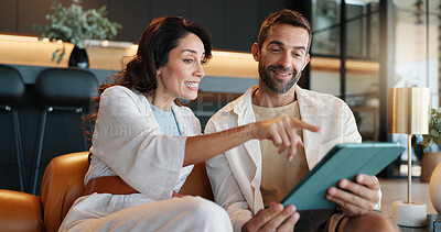 Buy stock photo Couple, tablet and happy on sofa, point and choice with web sale, discount and promotion in home. Mature people, man and woman with e commerce app, excited and search for deal with online shopping