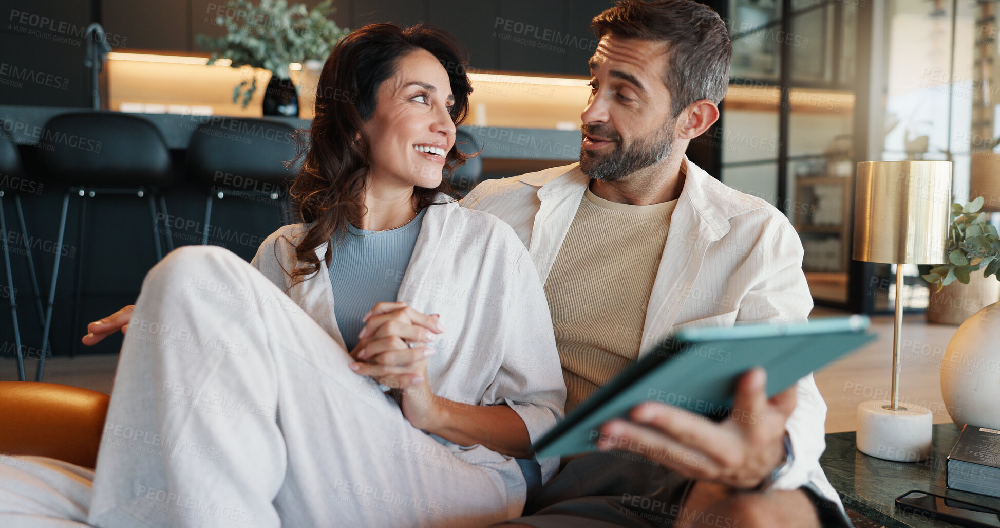 Buy stock photo Mature couple, tablet and talk on sofa, smile and memory with streaming, video or film on web in home. People, man and woman with digital touchscreen, app and choice for movies in lounge at apartment