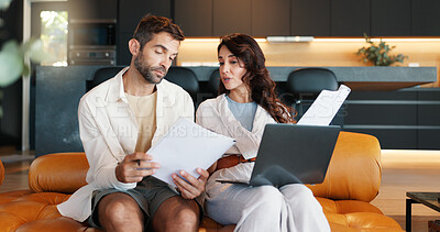 Buy stock photo Home, documents and couple with laptop, conversation and planning for savings. Budget, apartment and man with woman on sofa, paperwork and computer with discussion, tax report and asset management