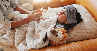 Buy stock photo Hands, thermometer and mother with sick child in home for help, support or check temperature for health. Girl, parent and kid with fever on sofa for care with virus disease, illness or cold allergies