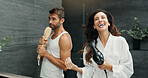 Singing, happy and couple in bathroom in mirror for bonding, having fun and relax together. Love, marriage  and woman and man for wellness, playful and healthy relationship for morning routine