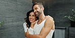 Hug, happy and couple in bathroom in mirror for bonding, cleaning and relax together. Love, marriage and woman and man for wellness, grooming and healthy relationship for morning routine in home