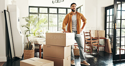 Buy stock photo New house, proud and man with boxes, real estate and ownership of property with mortgage and lounge. Relocation, buyer and person with cardboard in living room, investment and purchase with home loan