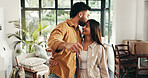 Key, kiss and couple with happiness in new home with pride for property investment or real estate. Smile, love and man with woman with ownership for house with goal for buying apartment together.