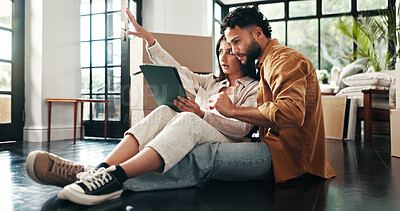 Buy stock photo Tablet, project and couple in new home with planning for renovation, development or moving. Cardboard package, real estate and man with woman on digital technology for online order in apartment.