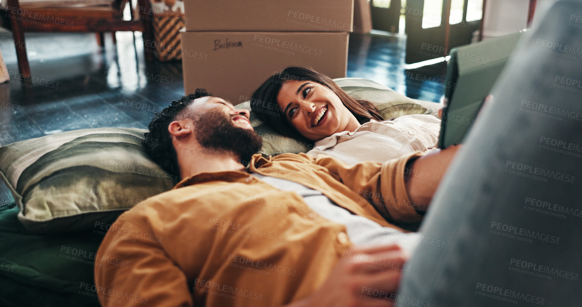 Buy stock photo Smile, couple and rest with tablet in new home for discussion, interior design and online shopping. People, talk or digital app for planning, furniture search or boxes for start of renovation process