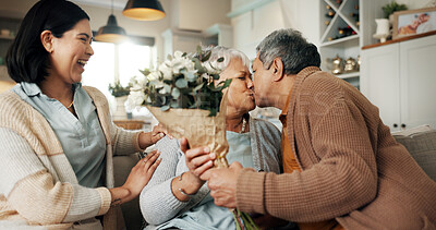 Buy stock photo Birthday, flowers or kiss with family on sofa in living room of home together for bonding or celebration. Bouquet, gift or love with senior parents and daughter in apartment for event or milestone