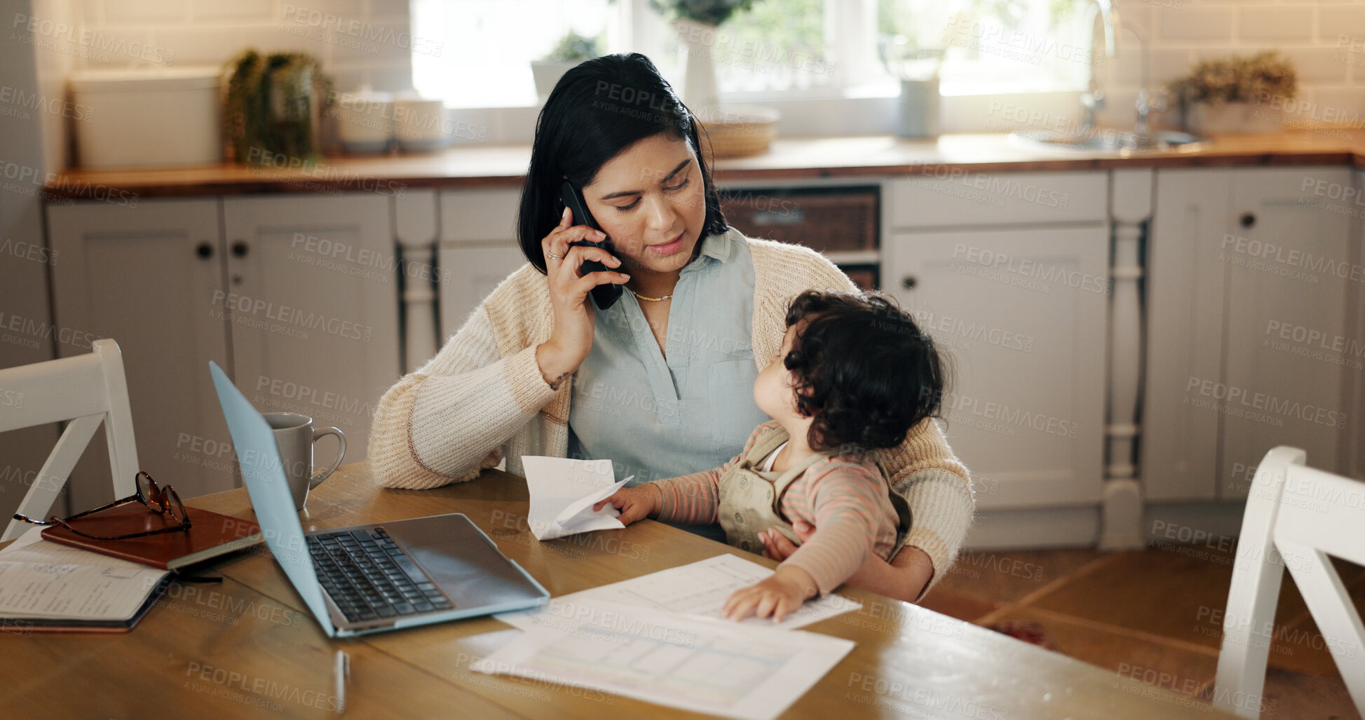 Buy stock photo Phone call, child and mom with laptop, remote work and bookkeeper with paperwork for project and talking. Multitasking, woman and communication with contact in kitchen, distraction and baby in house