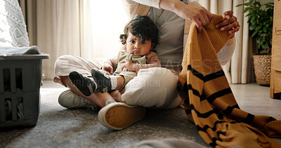Buy stock photo Baby, portrait and mother with laundry in home for domestic chores, motherhood or housekeeping. Hygiene, hands of woman and boy with packing clothes for spring cleaning, housework or bonding on floor