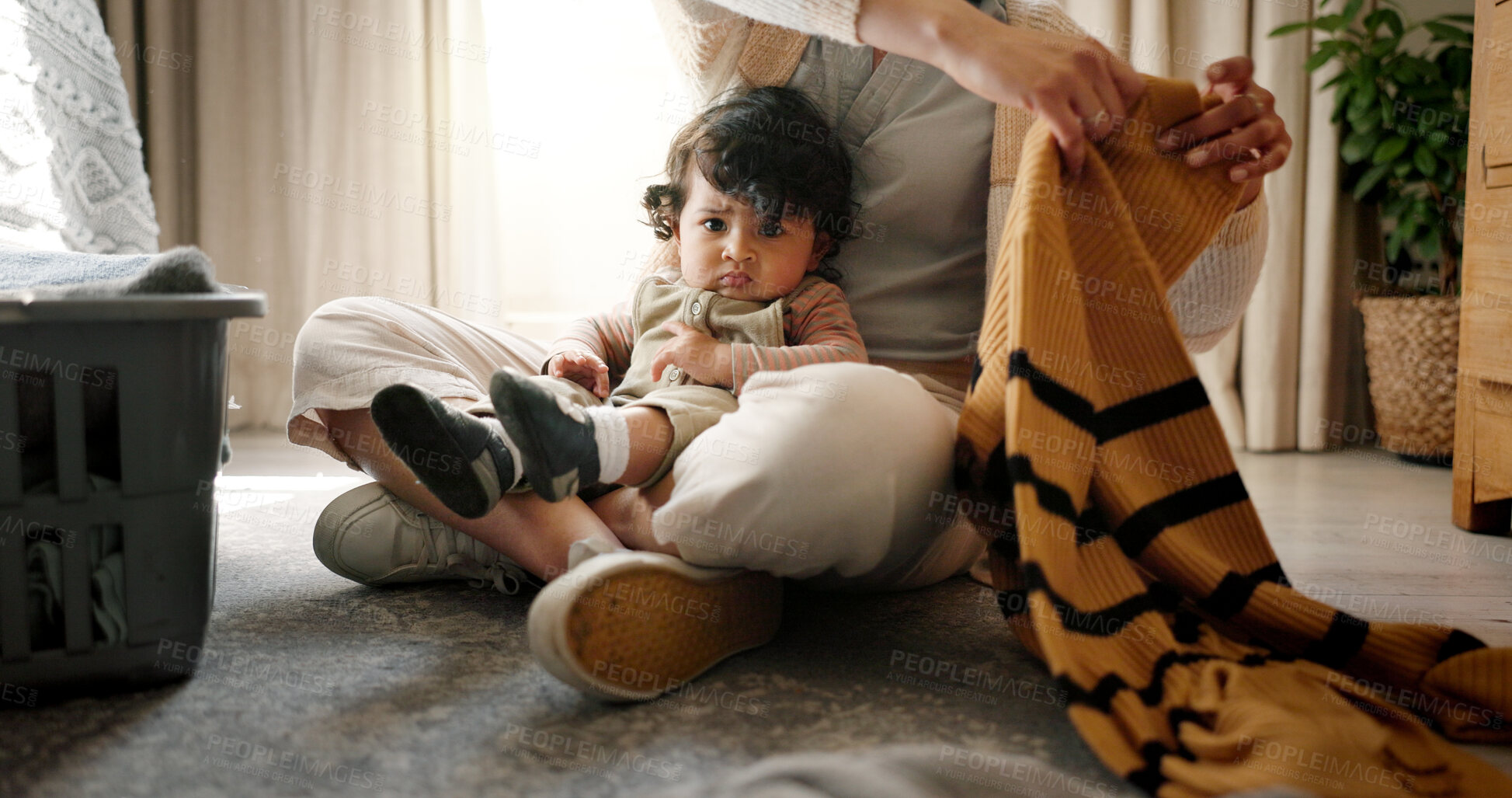 Buy stock photo Baby, portrait and mother with laundry in home for domestic chores, motherhood or housekeeping. Hygiene, hands of woman and boy with packing clothes for spring cleaning, housework or bonding on floor