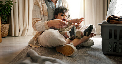 Buy stock photo Crying, playing and mother with baby in home with tantrum, frustration and upset for development. Bonding, quality time and mom relax with infant on floor for connection together in living room.