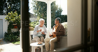 Buy stock photo Bonding, smile and senior couple with coffee, home and elderly people with beverage for chat and morning. Happy, old man and mature woman with tea on patio, comfortable and conversation for family