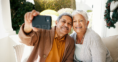 Buy stock photo Senior couple, selfie and happy on sofa, love and bonding with connection, memory and post on anniversary. Elderly man, woman and smile for photography, profile picture or social media in retirement
