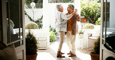 Buy stock photo Mature couple, dancing and happy in home with love, bonding and celebration for anniversary. People, man and woman with holding hands, retirement and smile with rhythm for relationship at house