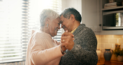Buy stock photo Senior couple, dancing and love in kitchen with smile, bonding and celebration for anniversary. People, man and woman with holding hands, retirement and happy with rhythm for relationship at house