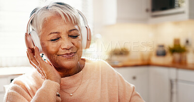 Buy stock photo Smile, headphones and music with old woman in kitchen for streaming, audio subscription and podcast. Happiness, retirement and relax with senior person in home for sound, listening and radio