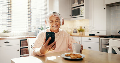 Buy stock photo Coffee, headphones or old woman in home with phone for streaming subscription, app or entertainment. Music, eating or happy senior person with food, smile or mobile for retirement, radio or podcast