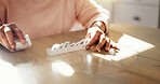 Elderly, hands and pills container in home for prescription medication, tablets dosage or health management. Senior person, medicine and capsule organzier for sorting drugs, daily routine or reminder