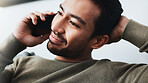 Phone call, relax and man on sofa in home for communication, social networking and chatting. Living room, house and person listening on smartphone for contact, online conversation and connection
