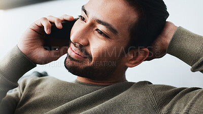 Buy stock photo Phone call, relax and man on sofa in home for communication, social networking and chatting. Living room, house and person listening on smartphone for contact, online conversation and connection