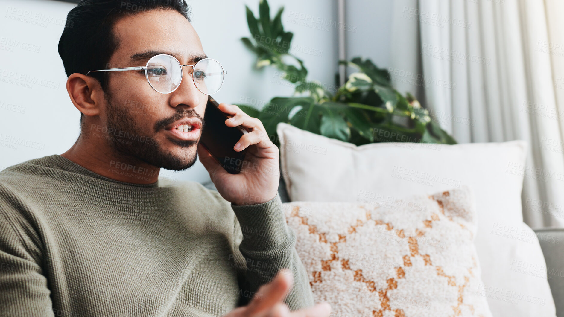 Buy stock photo Phone call, upset and man on sofa in home for communication, social networking and talking. Living room, crisis and frustrated person on smartphone for contact, online conversation and connection