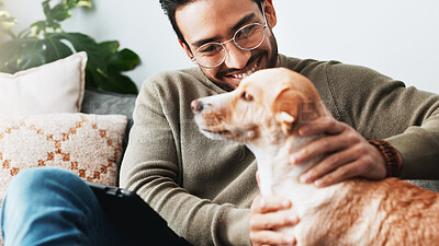 Buy stock photo Happy, man and play with dog in home for love, care and bonding together as friends or companion. Pet animal, stroke and person in living room on sofa for support, connection and relax with tablet