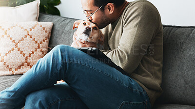 Buy stock photo Kiss, man and love for dog in home with care, loyalty and bonding together as friends or companion. Pet animal, connection or person in living room on sofa for support, affection or relax with tablet