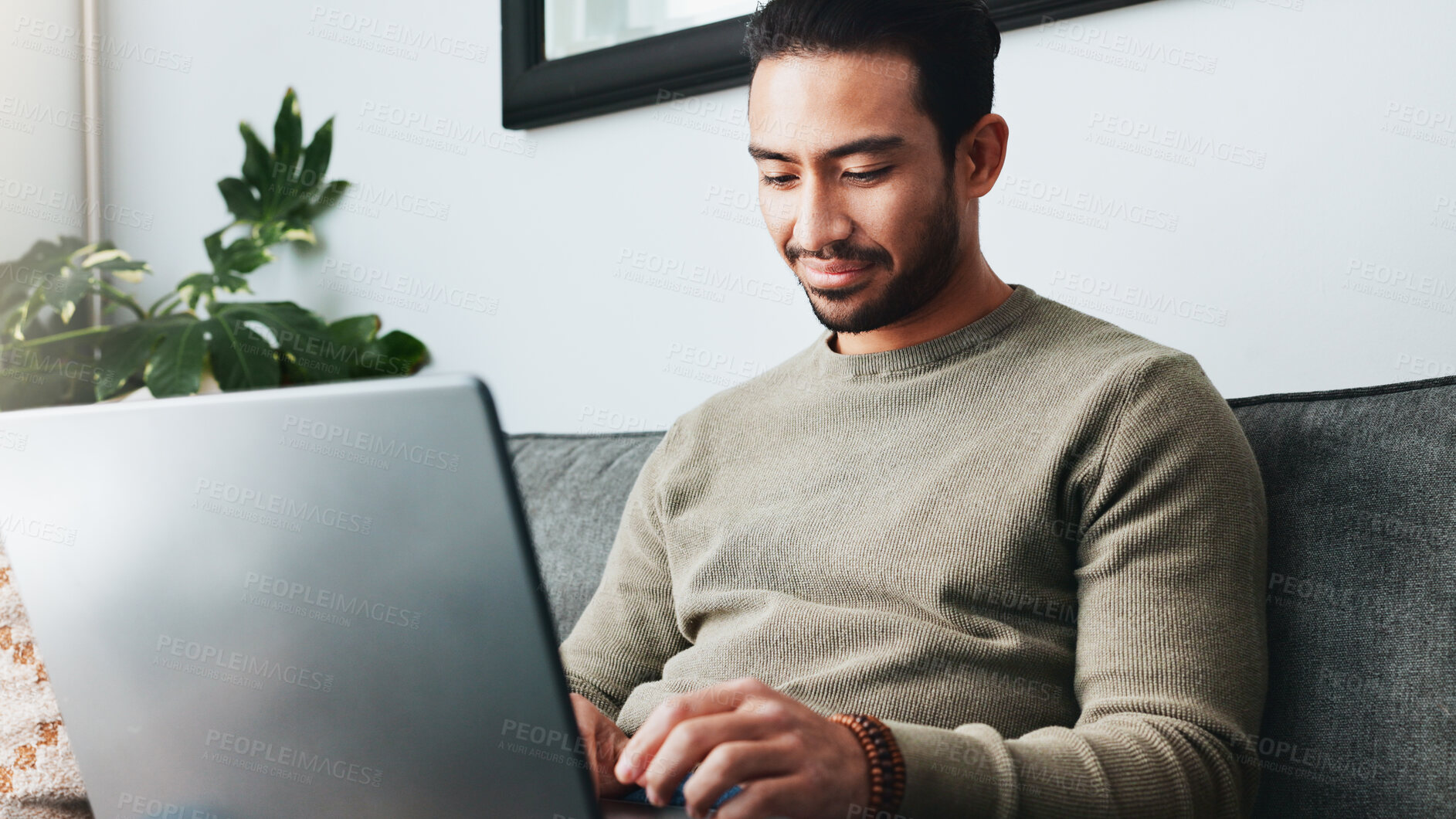 Buy stock photo Research, online and laptop with man on sofa for freelancer, networking and email response. Reading, communication and remote worker with person in living room of home for business proposal or typing