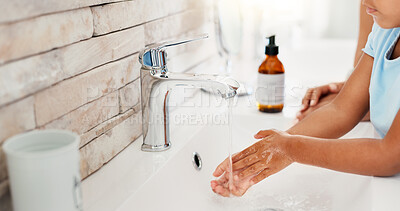 Buy stock photo Washing hands, child and parent with water, faucet and helping with hygiene, soap and bacteria in home. People, kid and cleaning with liquid, foam and routine for wellness in morning at family house