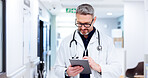 Mature, man or doctor on tablet for results, medical update or appointment booking online. Smile, research or surgeon with touchscreen for cardiology report, schedule or health app at hospital clinic