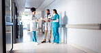Hospital, meeting and doctors in hallway with notes for consulting, patient results and planning. Healthcare, collaboration and man and women with for medical service, diagnosis and help in clinic