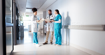 Buy stock photo Hospital, meeting and doctors in hallway with notes for consulting, patient results and planning. Healthcare, collaboration and man and women with medical service, diagnosis and help in clinic